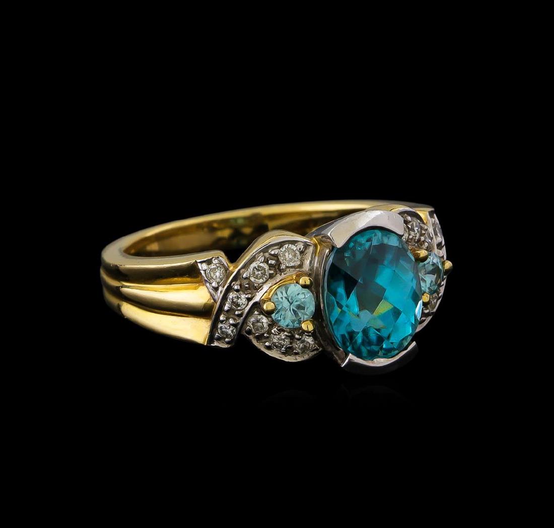 4.19 ctw Blue Zircon and Diamond Ring - 14KT Yellow: One electronically tested 14KT yellow and white gold lady's combination cast & assembled fashion ring with a bright polish finish. The featured lady's ring has a shank measuring 2.65 millimeters in wi