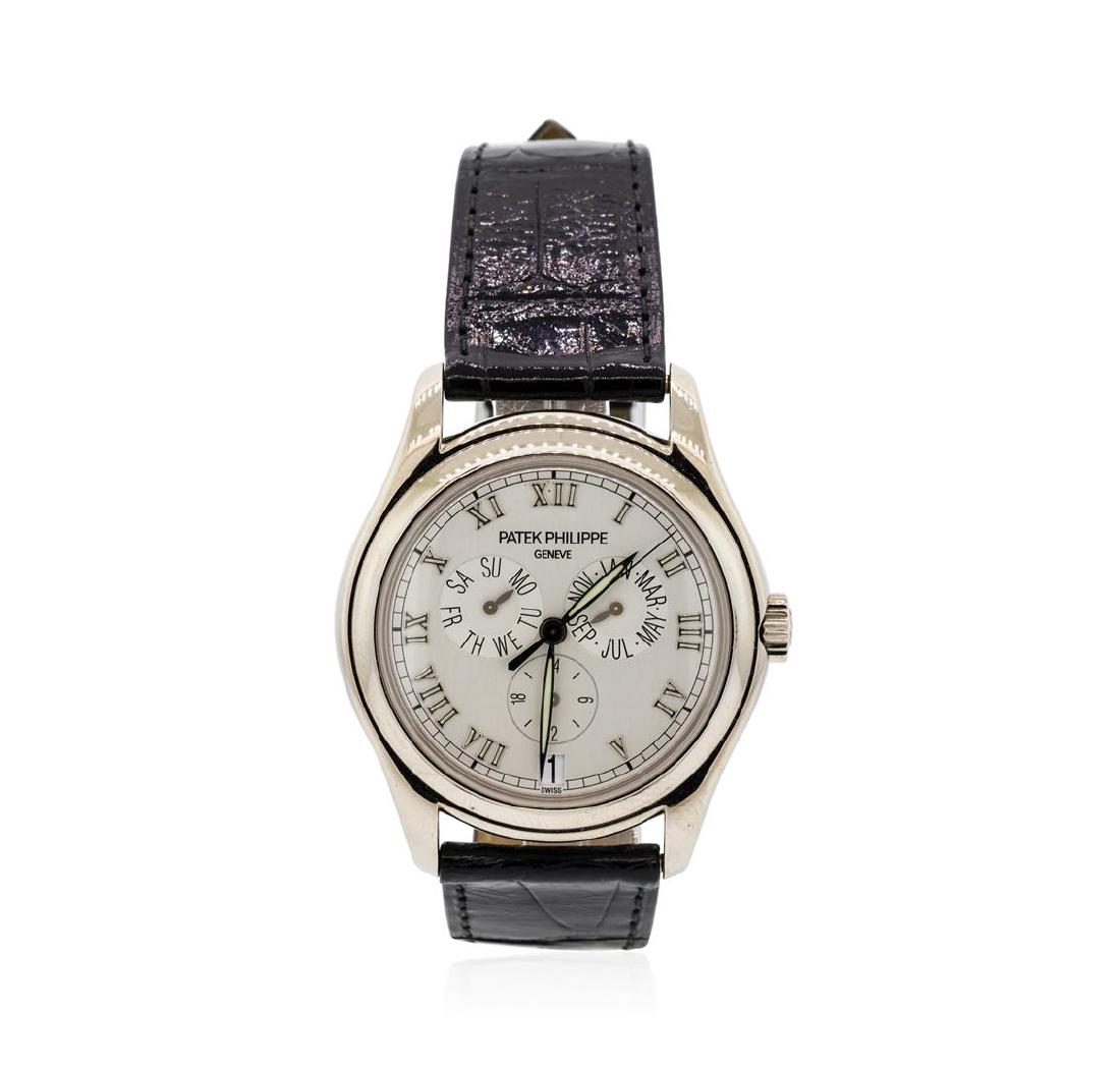 Patek Philippe 18KT White Gold Annual Calendar: One Patek Philippe Annual Calendar automatic watch with open exhibition case back, smooth bezel, white flat dial, Roman numerals, three subdials, luminous hands, date display, black alligator strap an
