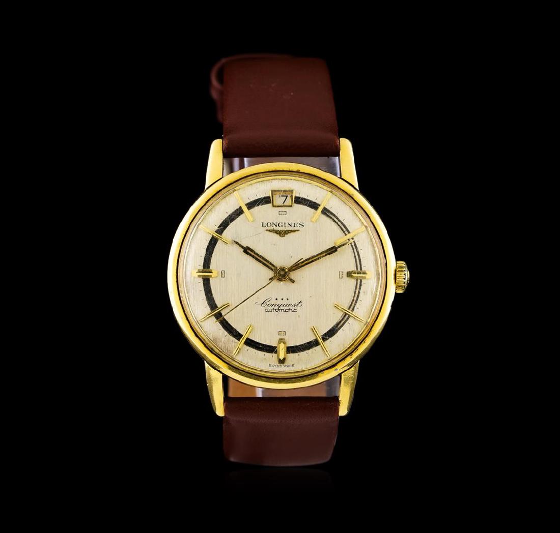 Longines Yellow Gold Conquest Automatic Watch: One Longines Conquest watch featuring: Movement: Automatic. Case: Yellow gold. Case Shape: Round. Bezel: Yellow gold. Dial: Silver color; gold tone hands; gold tone hour markers. Features: Date window