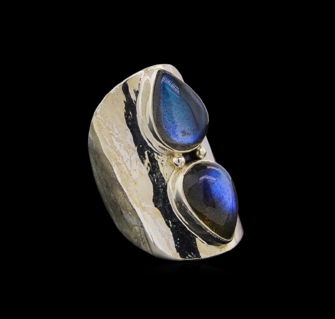 Sterling Silver Ring: One of a kind high fashion sterling silver Ring weighing 16.1 grams. Containing: Labradorite. This sterling silver promises a lasting shine.