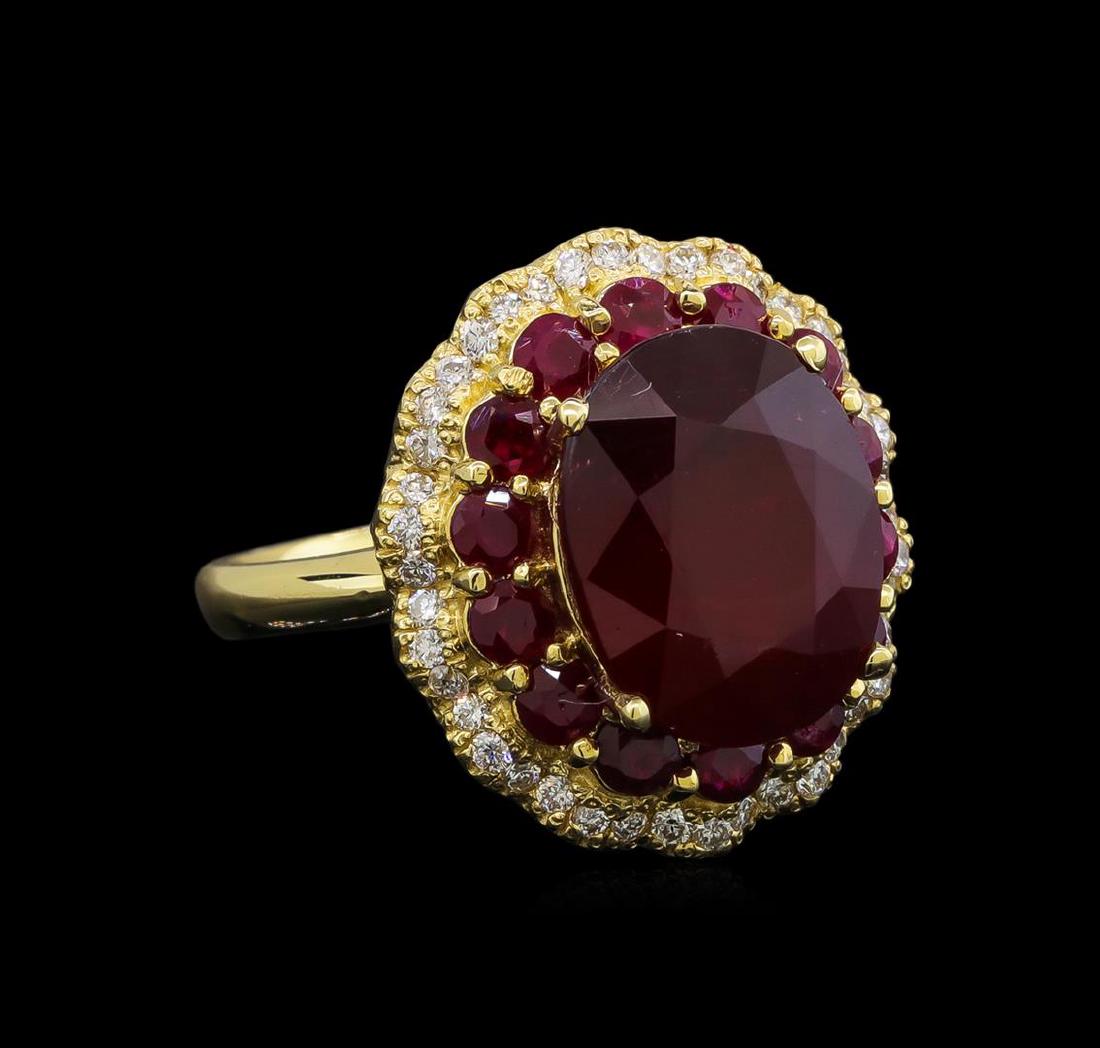 14KT Yellow Gold 10.13 ctw Ruby and Diamond Ring: One electronically tested 14KT yellow gold ladies cast ruby and diamond ring with a bright polish finish. Identified with markings of "K14". Condition is new. Containing: One prong set oval modified b