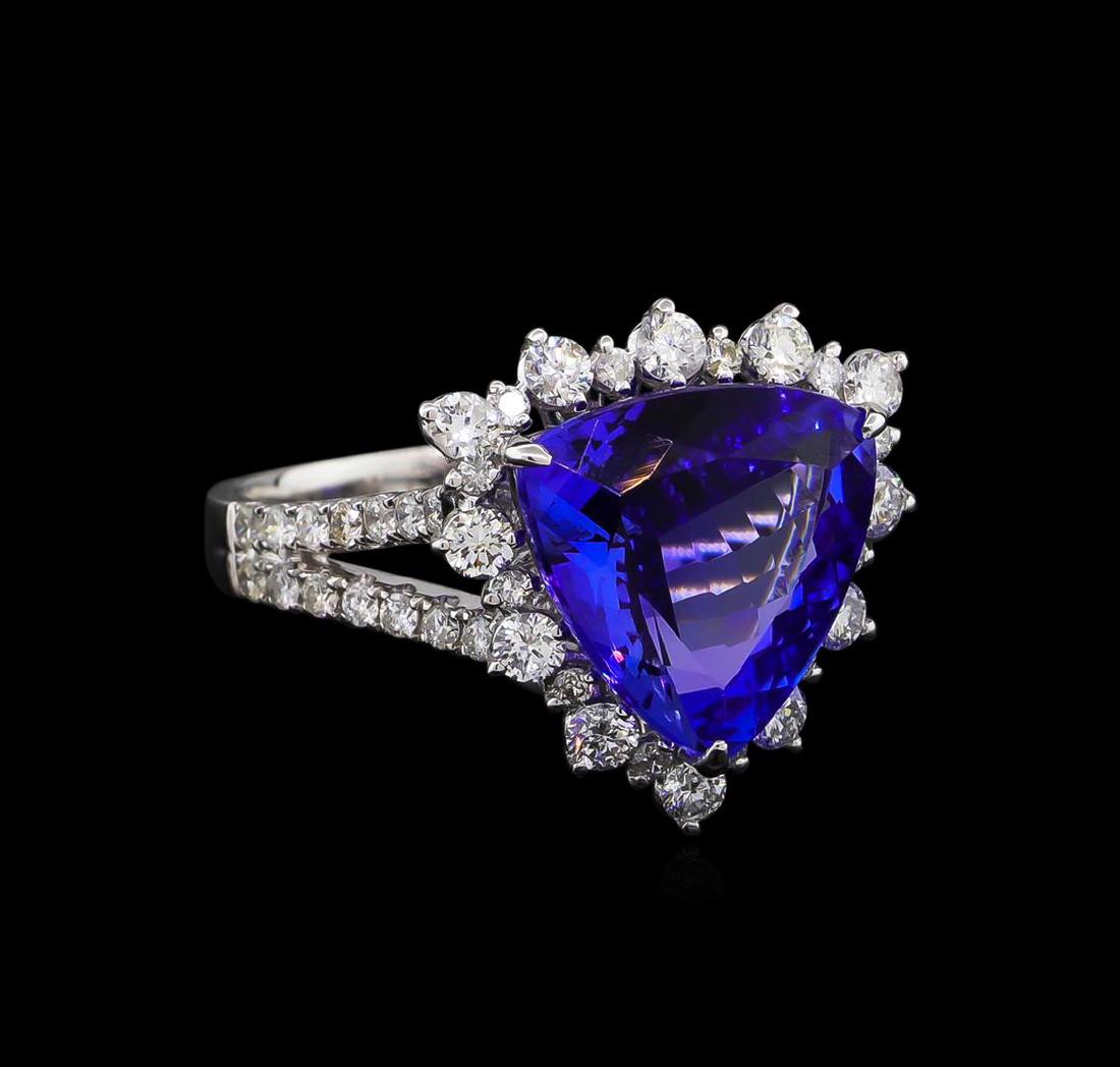14KT White Gold 5.30 ctw Tanzanite and Diamond Ring: One electronically tested 14KT white gold ladies cast tanzanite and diamond ring with a bright polish finish. Condition is new, good workmanship. The featured tanzanite is set within a diamond lattice