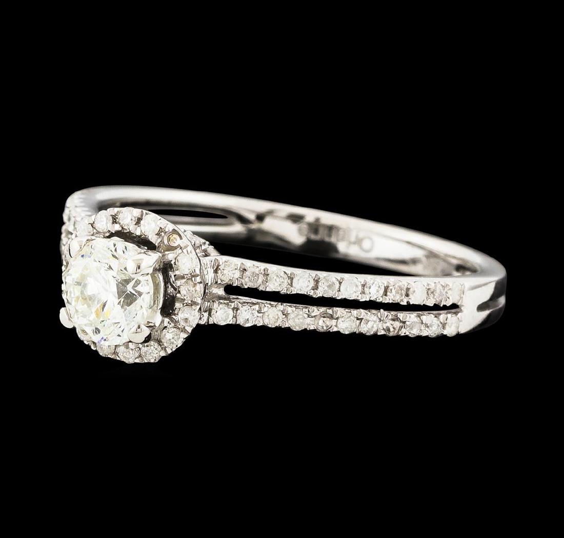 0.80 ctw Diamond Ring - 14KT White Gold: One electronically tested 14KT white gold lady's cast wedding ring with a split shank basket halo with a bright polish finish. The featured lady's ring has a shank measuring 2.08 millimeters wide. Tra