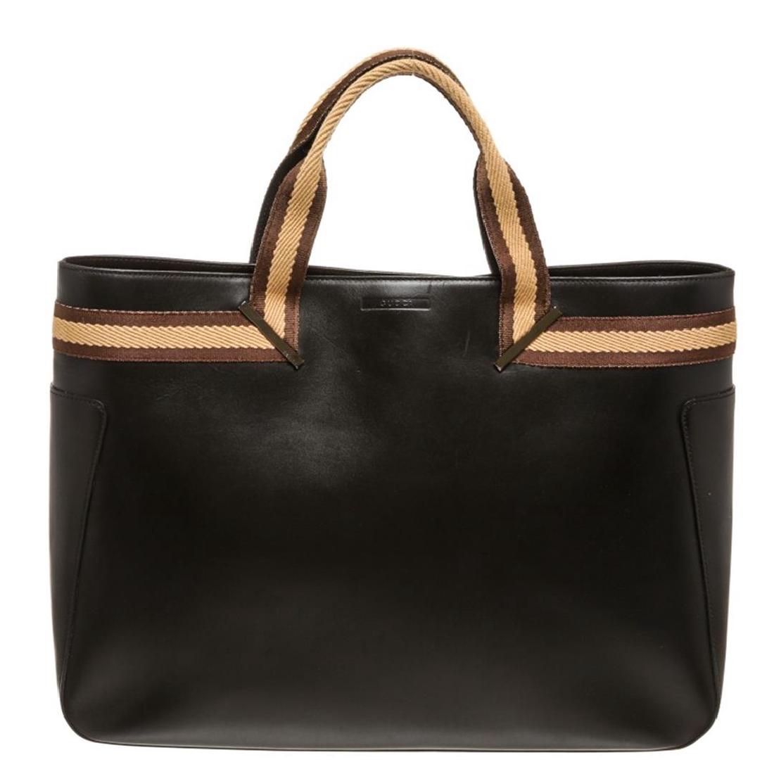 Gucci Black Brown Leather Double Handle Tote Bag: Overall magnetic button closure.Interior contains fabric lining with one side zipper pocket. Item is pre-owned.