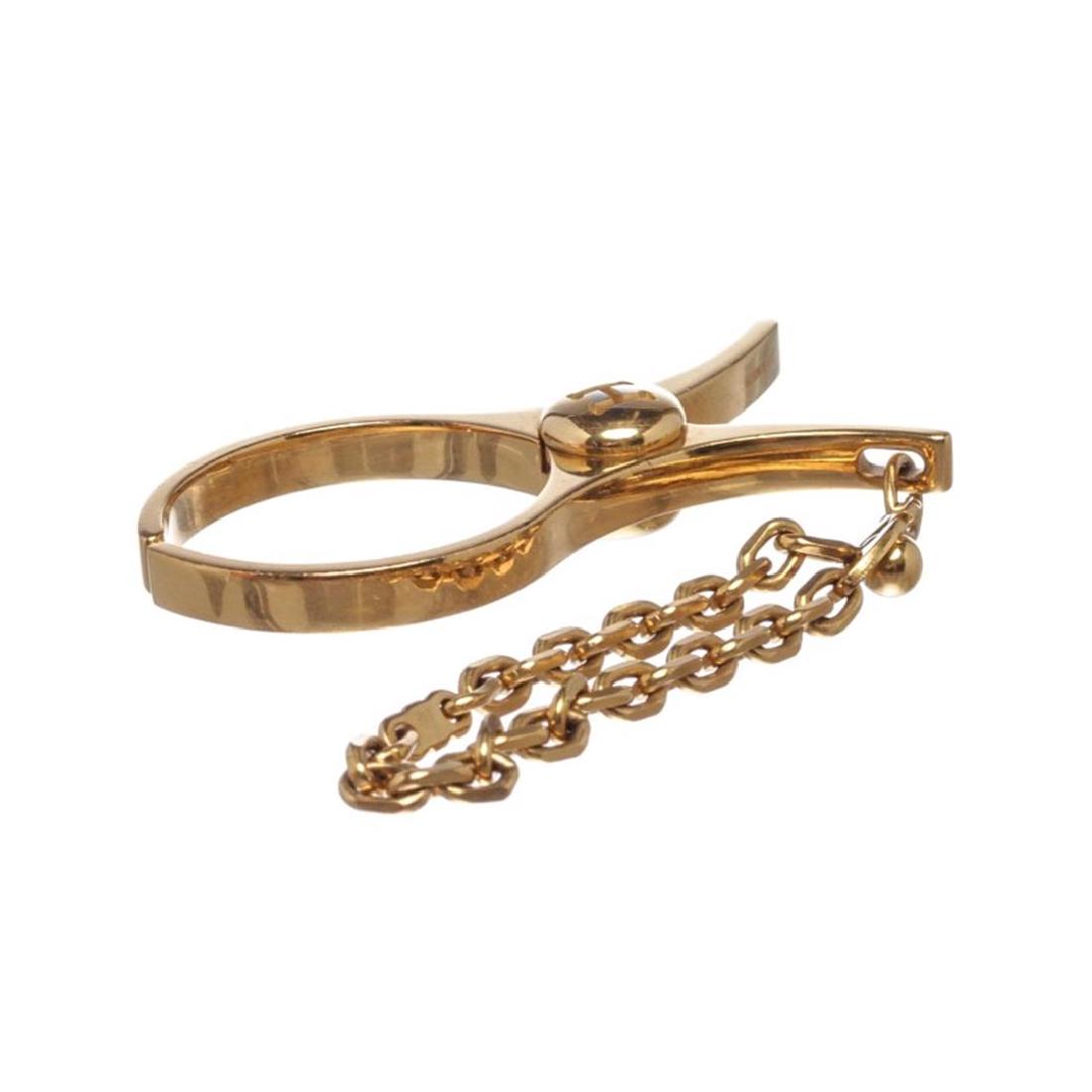 Hermes Gold Plated Filou Glove Clip: One Hermes Gold Plated Filou Glove Clip. Crafted out gold plated metal.