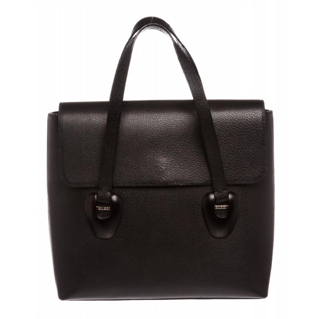 Gucci Black Leather Flap Tote Handbag: One Gucci Black Leather Flap Tote Handbag. Crafted out of black leather, dual flat handles, and flap magnetic snap closure. Inner black suede lining and side zip pocket. Item is pre-owned.