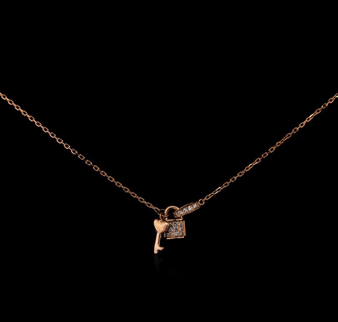 0.12 ctw Diamond Lock and Key Pendant With Chain - 14KT: One lock and key pendant with chain featuring: 14KT rose gold weighing 2.70 grams containing diamonds with a total weight of 0.12ct.