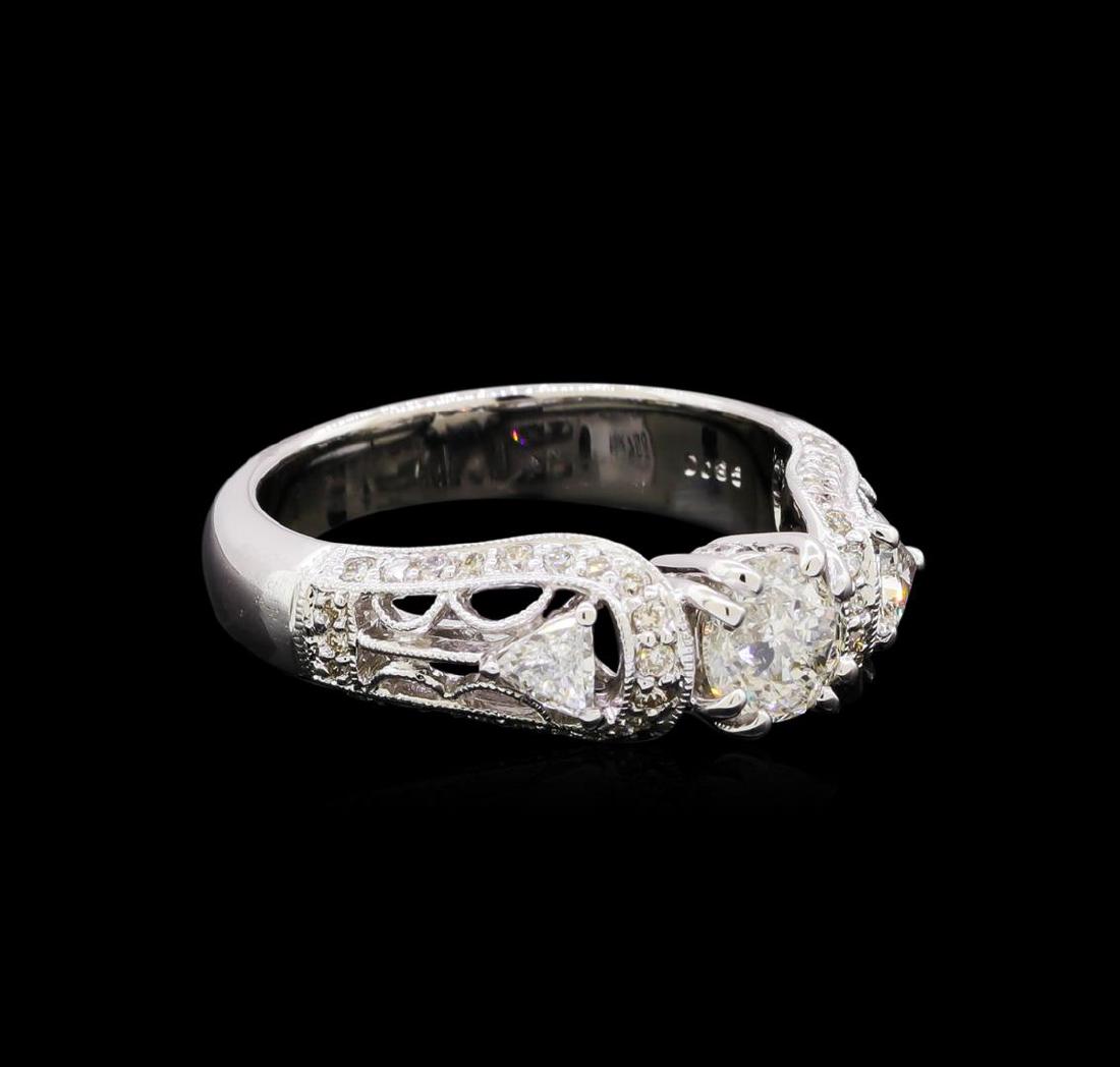 1.33 ctw Diamond Ring - 18KT White Gold: One electronically tested 18KT white gold lady's cast vintage wedding ring with a bright polish with milgrain detailing finish. The featured lady's ring has a shank measuring 3.90 millimeters in width