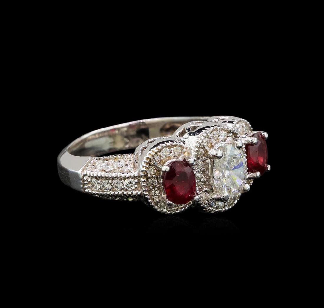 14KT White Gold 0.84 ctw Ruby and Diamond Ring: One electronically tested 14KT white gold ladies cast ruby and diamond ring with a bright polish finish. Identified with markings of "14K". Condition is new. Containing: One prong set oval shaped cut 