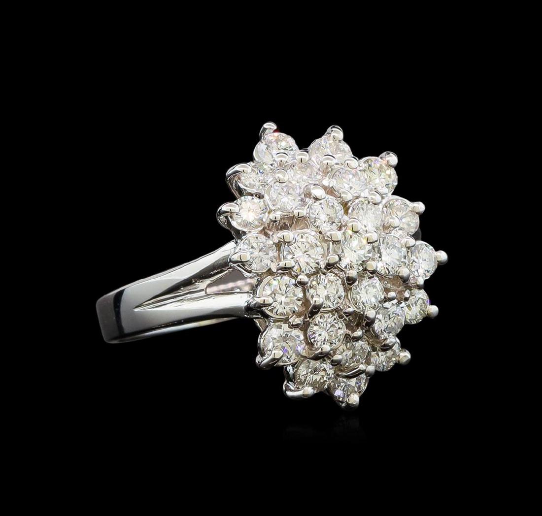 14KT White Gold 1.47 ctw Diamond Ring: One electronically tested 14KT white gold ladies cast diamond ring with a bright polish finish. Identified with markings of "14K". Condition is new. Containing: Twenty-Seven prong set round brilliant 