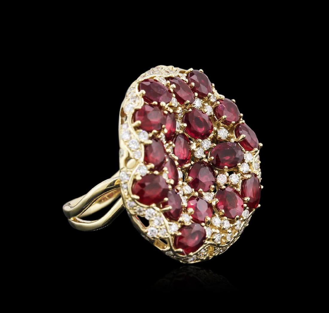 14KT Yellow Gold 9.11 ctw Ruby and Diamond Ring: One electronically tested 14KT yellow gold ladies cast ruby and diamond ring with a bright polish finish. Identified with markings of "585". Condition is new. Containing: Nineteen prong set oval modif