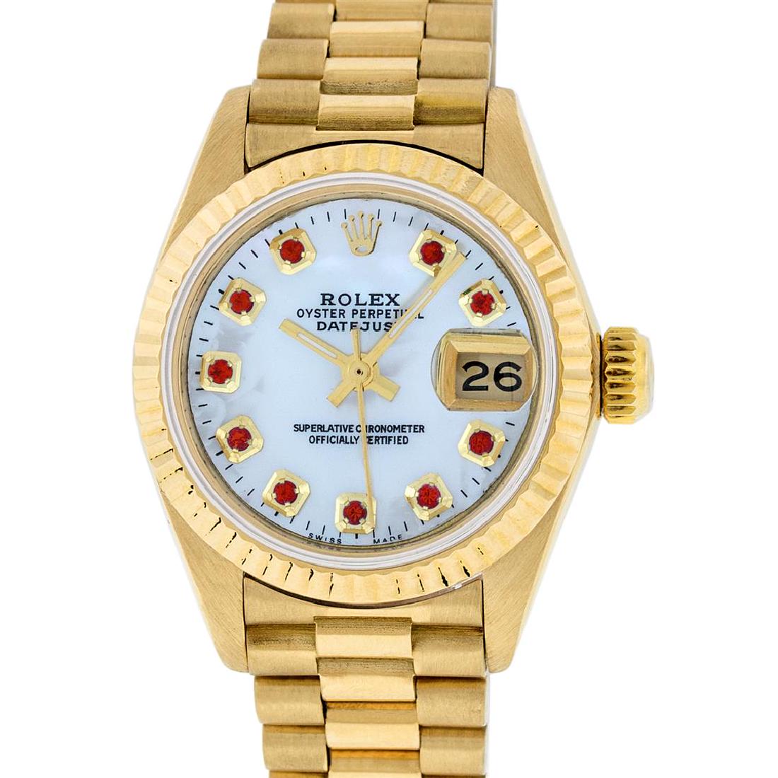 Rolex 18KT Gold President Ruby Ladies Watch: One Ladies 18K Rolex President Polished, Serviced & Electronically Tested, Yellow Gold Case: 26mm, 18K Yellow Gold Crown, Bezel: 18K Yellow Gold Fluted Bezel. Custom Crystal: Synthetic Acrylic Cyclops
