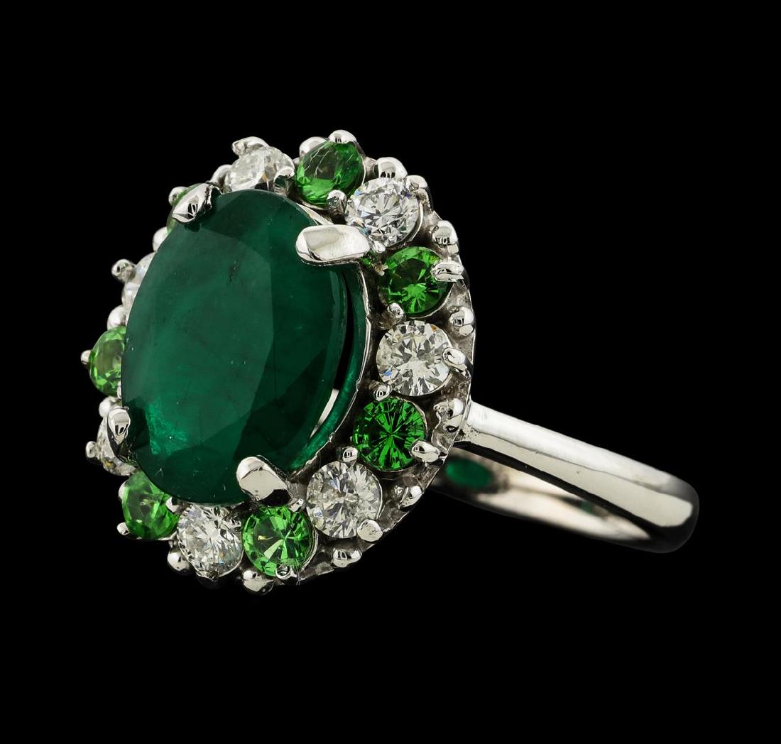 3.12 ctw Emerald, Tsavorite and Diamond Ring - 14KT: One ring : 14KT white gold weighing 4.92gm containing emerald with a total weight of 3.12ct, tsavorite weighing 0.57ctw and diamonds weighing 0.58ctw.