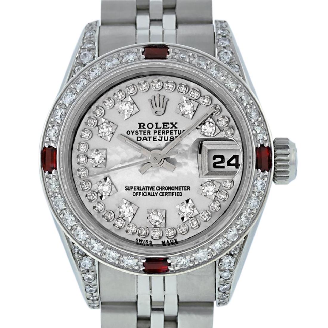 Rolex Ladies SS Diamond Lugs MOP VS Diamond And Ruby: One Ladies Rolex Datejust Polished Bright with Satin Finish, Serviced & Electronically Tested, Stainless Steel Case:26mm, Stainless Steel Crown, Diamond Lugs: 16 Diamonds On Lugs, Clarity: SI-VS, Colo