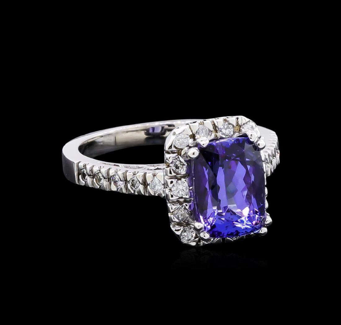 3.30 ctw Tanzanite and Diamond Ring - 14KT White Gold: One ring featuring: 14KT white gold weighing 5.38 grams containing one tanzanite with a total weight of 3.30ct and diamonds with a total weight of 0.38ct.