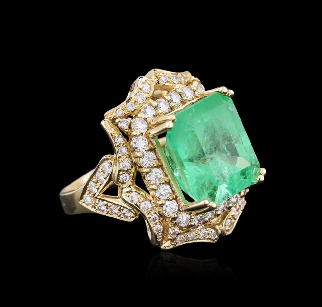 14KT Yellow Gold GIA Certified 10.21 ctw Emerald and: One electronically tested 14KT yellow gold ladies cast emerald and diamond ring with a bright polish finish. Identified with markings of "K14". Condition is new. Containing: One prong set emerald stan