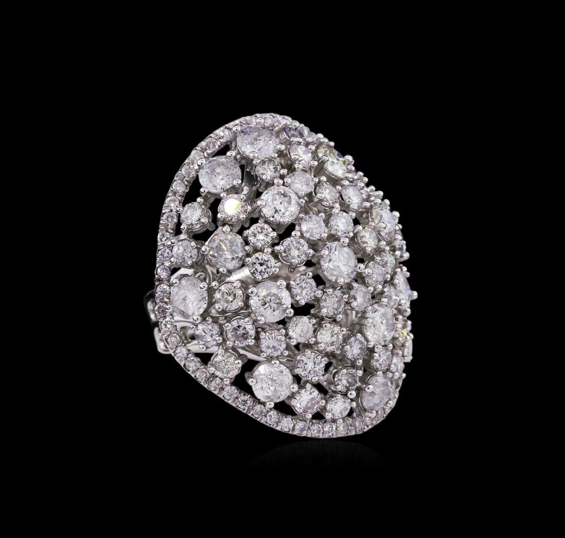 14KT White Gold 6.74 ctw Diamond Ring: One electronically tested 14KT white gold Ladies combination cast & assembled ring with a bright polish finish. Condition is new. Identified with markings of "14K". Containing: Fifty-Seven prong set r
