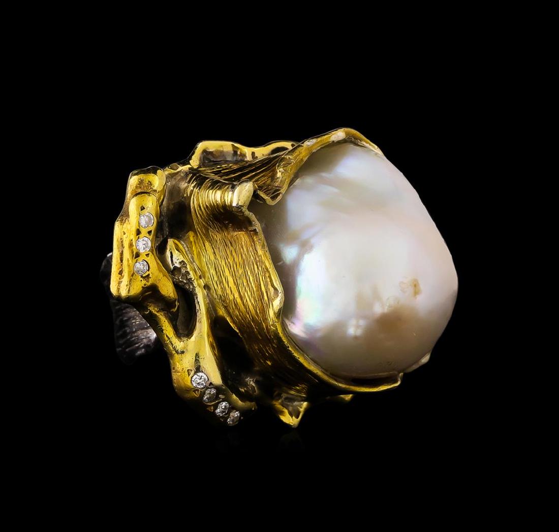 Sterling Silver Ring: One of a kind high fashion sterling silver Ring weighing 25.5 grams. Black Antique texture. Containing: Freshwater Pearl, White Crystal. This sterling silver promises a lasting shine.