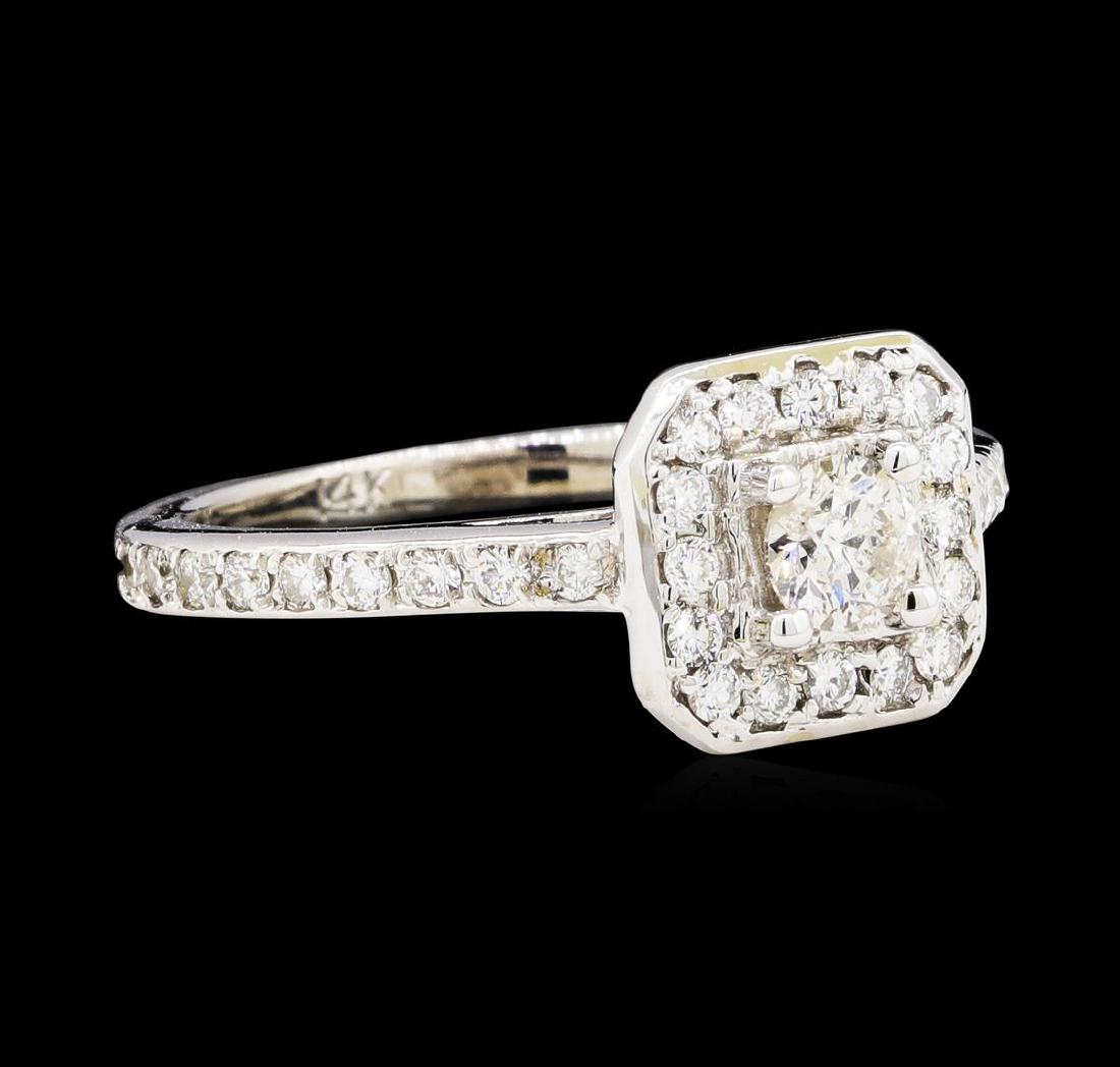 0.95 ctw Diamond Ring - 14KT White Gold: One electronically tested 14KT white gold lady's cast wedding ring with a cushion basket halo with a bright polish finish. The featured lady's ring has a shank measuring 1.90 millimeters wide. Identif