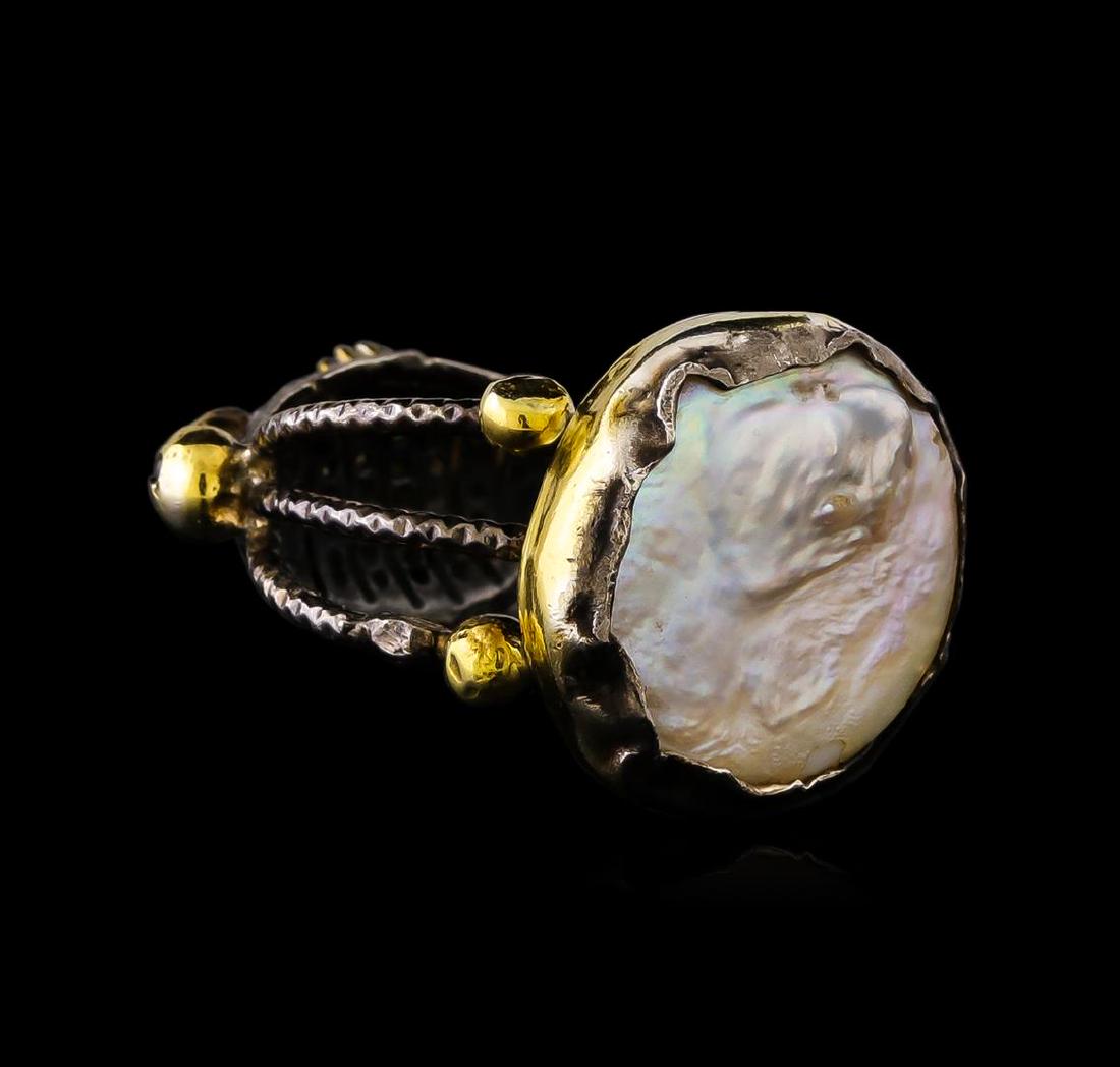 Sterling Silver Ring: One of a kind high fashion sterling silver Ring weighing 13.3 grams. Black Antique texture. Containing: Freshwater Pearl, Green Crystal, Black Crystal. This sterling silver promises a lasting shine.