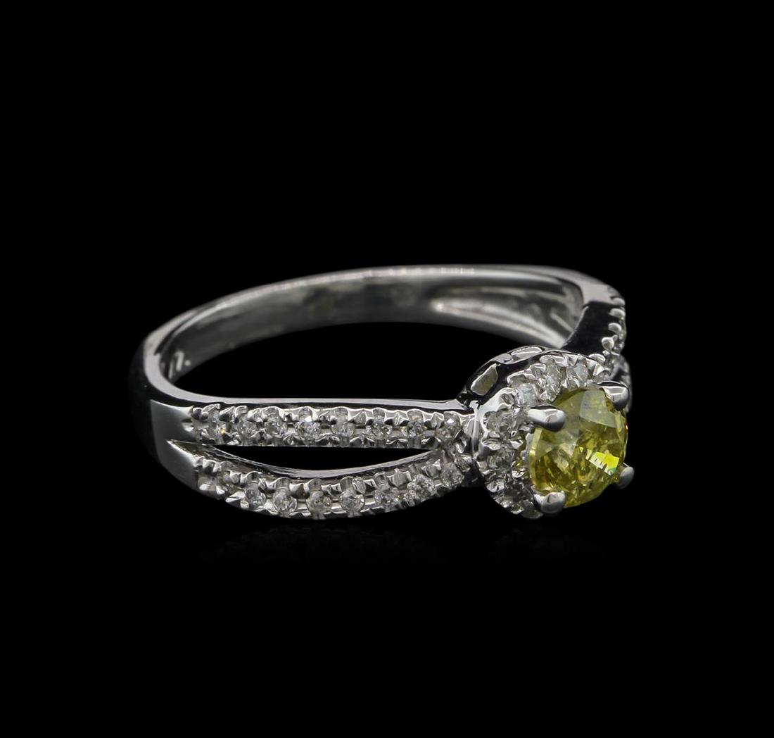 0.72 ctw Yellow Diamond Ring - 14KT White Gold: One ring featuring: 14KT white gold weighing 3.41 grams containing one yellow diamond center stone with a total weight of 0.48ct and 44 diamonds with a total weight of 0.24ct.