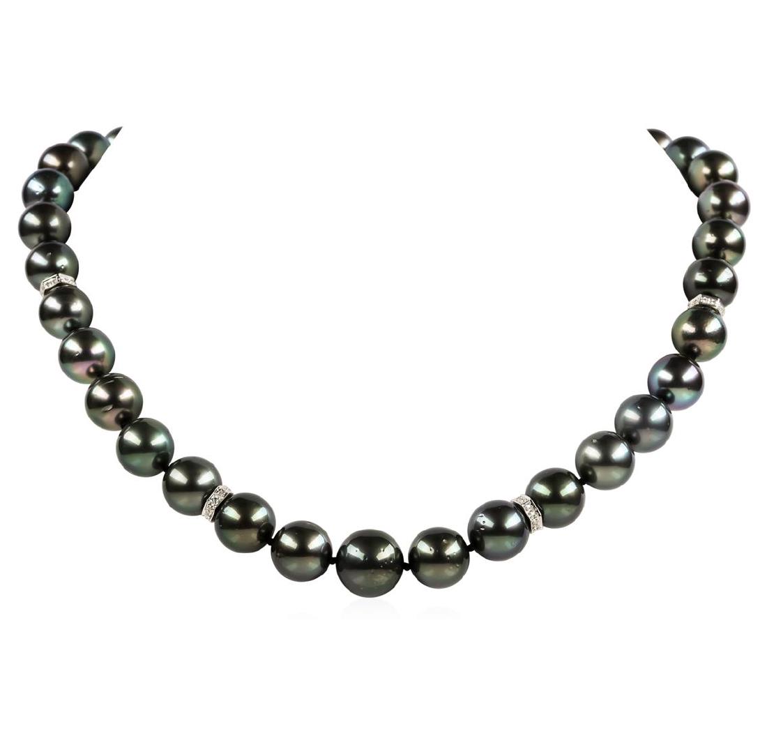 Pearl and Diamond Necklace: One graduated single strand pearl necklace 18.0' princess length, knotted with a tongue clasp & foldover safety containing 35 Tahitian pearls, 13.6mm to 11.0mm in size. The pearls are black in color, 