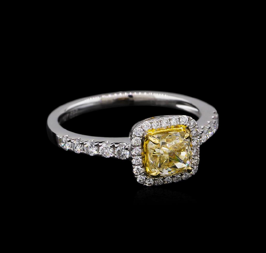 14KT White Gold 1.05 ctw SI1/Light Yellow Diamond Ring: One electronically tested 14KT white gold ladies cast diamond unity ring. Condition is new, good workmanship. The featured diamond is set within a diamond bezel supported by diamond set shoulders, com