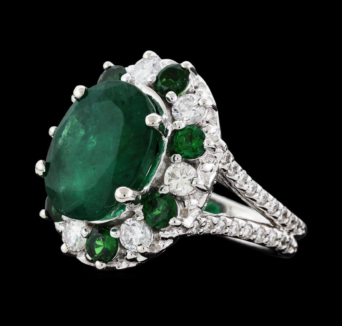 5.92 ctw Emerald, Tsavorite and Diamond Ring - 14KT: One electronically tested 14KT white gold lady's cast fashion ring with a split shank basket halo with a bright polish finish. The featured lady's ring has a double shank measuring 3.47 millimeters wi