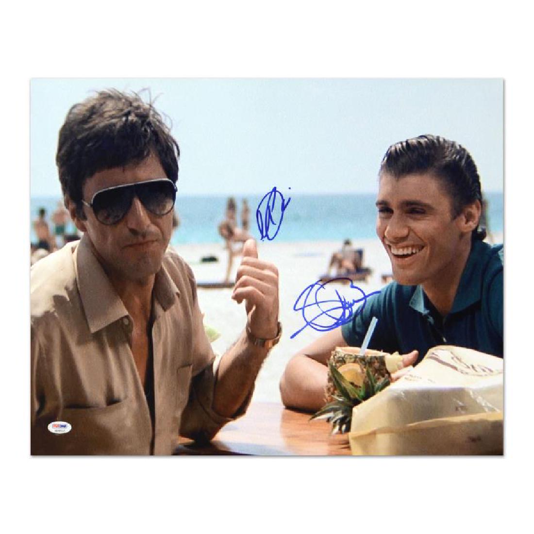 Scarface - Al Pacino & Steven Bauer by Pacino, Al: This is an autographed photo from the iconic film, "Scarface", hand signed by Al Pacino & Steven Bauer. This piece is presented with PSA/DNA Authentication, which authenticates memorabilia using propr