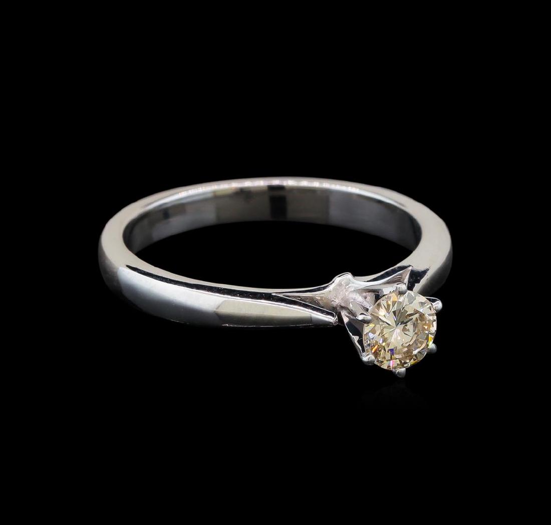 14KT White Gold 0.36 ctw Round Cut Fancy Brown Diamond: One electronically tested 14KT white gold ladies cast diamond solitaire ring with a flat shank with a bright polish finish. Identified with markings of "14K". Condition is new. Containing: One prong s