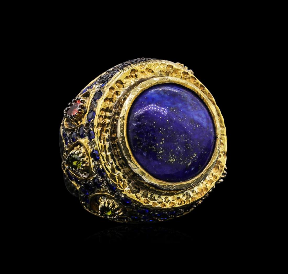 Sterling Silver Ring: One of a kind high fashion sterling silver Ring weighing 25.3 grams. Black Antique texture. Containing: Lapis, Ruby, Blue Crystal, Multi-color Crystals. This sterling silver promises a lasting shine.