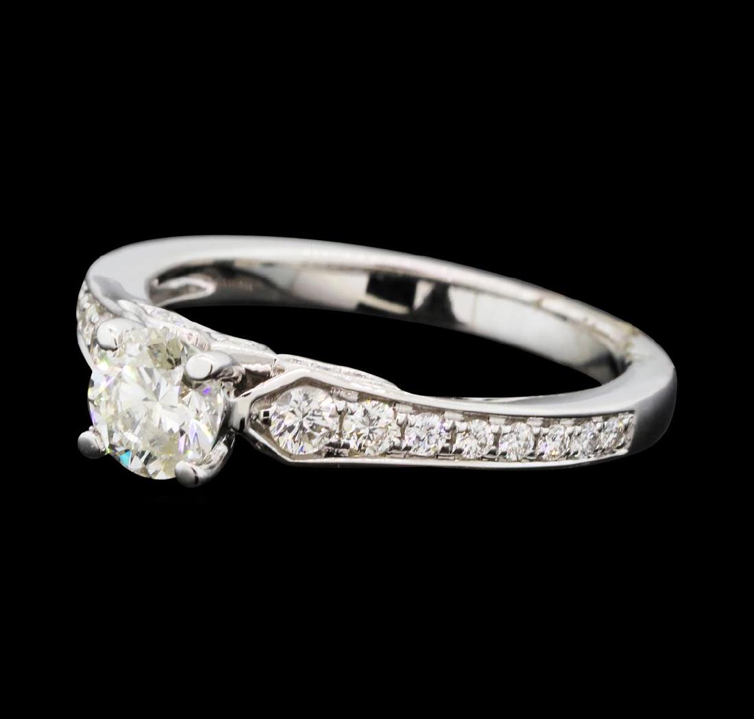 0.91 ctw Diamond Ring - 14KT White Gold: One electronically tested 14KT white gold lady's cast wedding ring with a cathedral shank with a bright polish finish. The featured lady's ring has a shank measuring 2.20 millimeters wide. Identified 