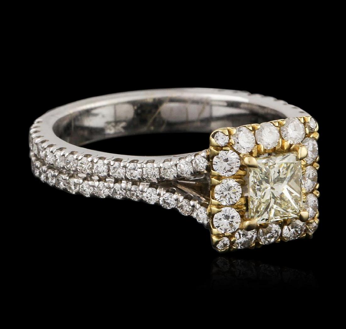 18KT Two-Tone Gold 0.83 ctw Fancy Yellow Diamond Ring: One electronically tested 18KT white and yellow gold ladies cast diamond engagement ring with a bright polish finish. Identified with markings of "18K". Condition is new. Containing: One prong set pri