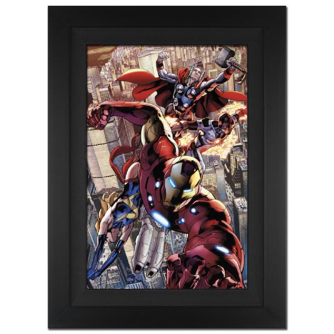 Avengers #12.1 by Stan Lee - Marvel Comics: A piece of comic book history, this limited edition, from original art by Bryan Hitch, depicts an adventure packed scene starring Iron Man, Ms. Marvel, Protector and Thor. British artist Bryan Hitch w
