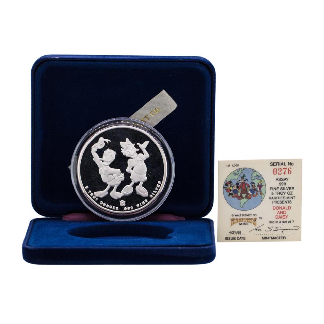 1988 Rarities Mint Walt Disney Donald & Daisy 5 oz .999: One 1988 Rarities Mint Walt Disney Donald & Daisy 5 oz .999 Silver Coin w/Box & COA.