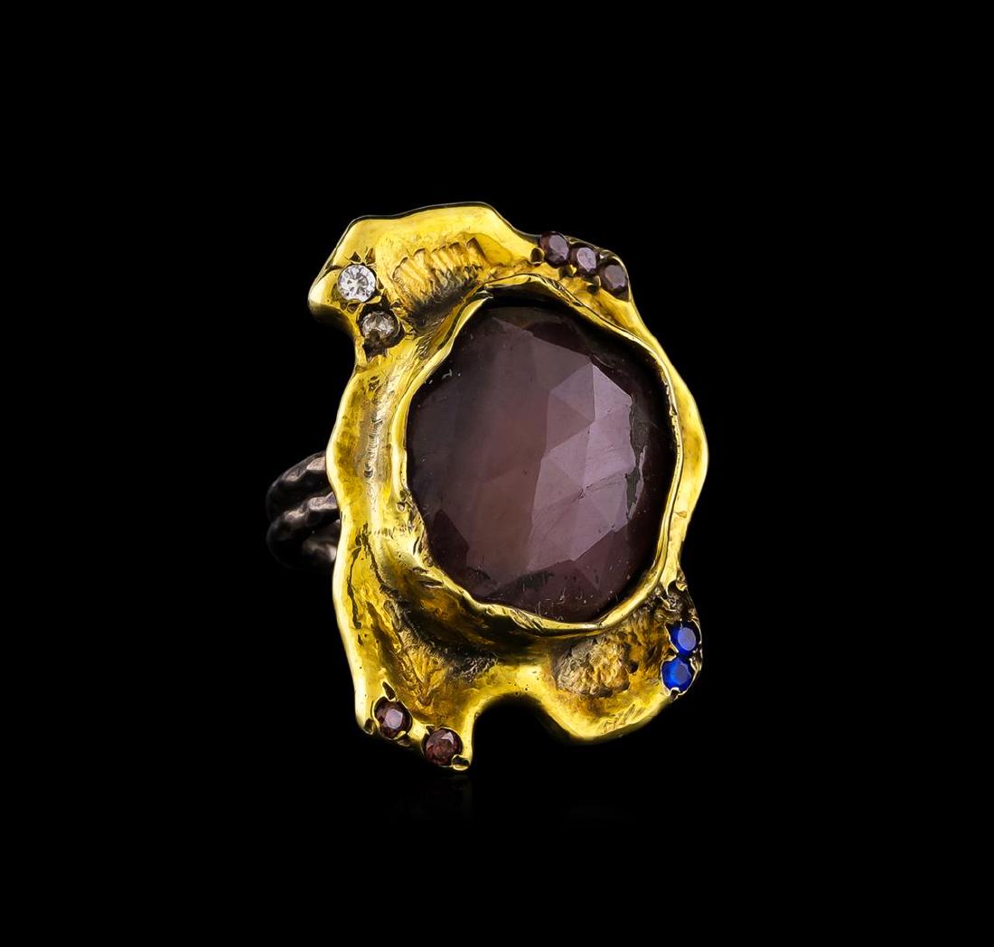 Sterling Silver Ring: One of a kind high fashion sterling silver Ring weighing 12 grams. Black Antique texture. Containing: Ruby, Blue Crystal, White Crystal, Brown Crystal. This sterling silver promises a lasting shine.