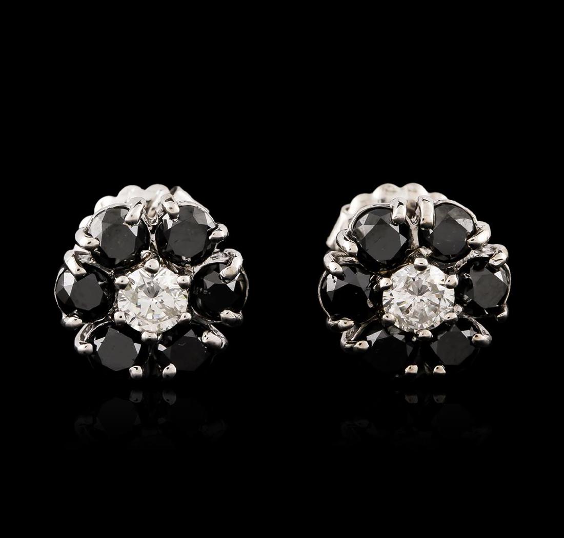 14KT White Gold 3.32 ctw Black and White Diamond: One pair electronically tested 14KT white gold ladies cast & assembled black and white diamond floret earrings with standard backs. Bright polish finish. Condition is good. Containing: Twelve prong se
