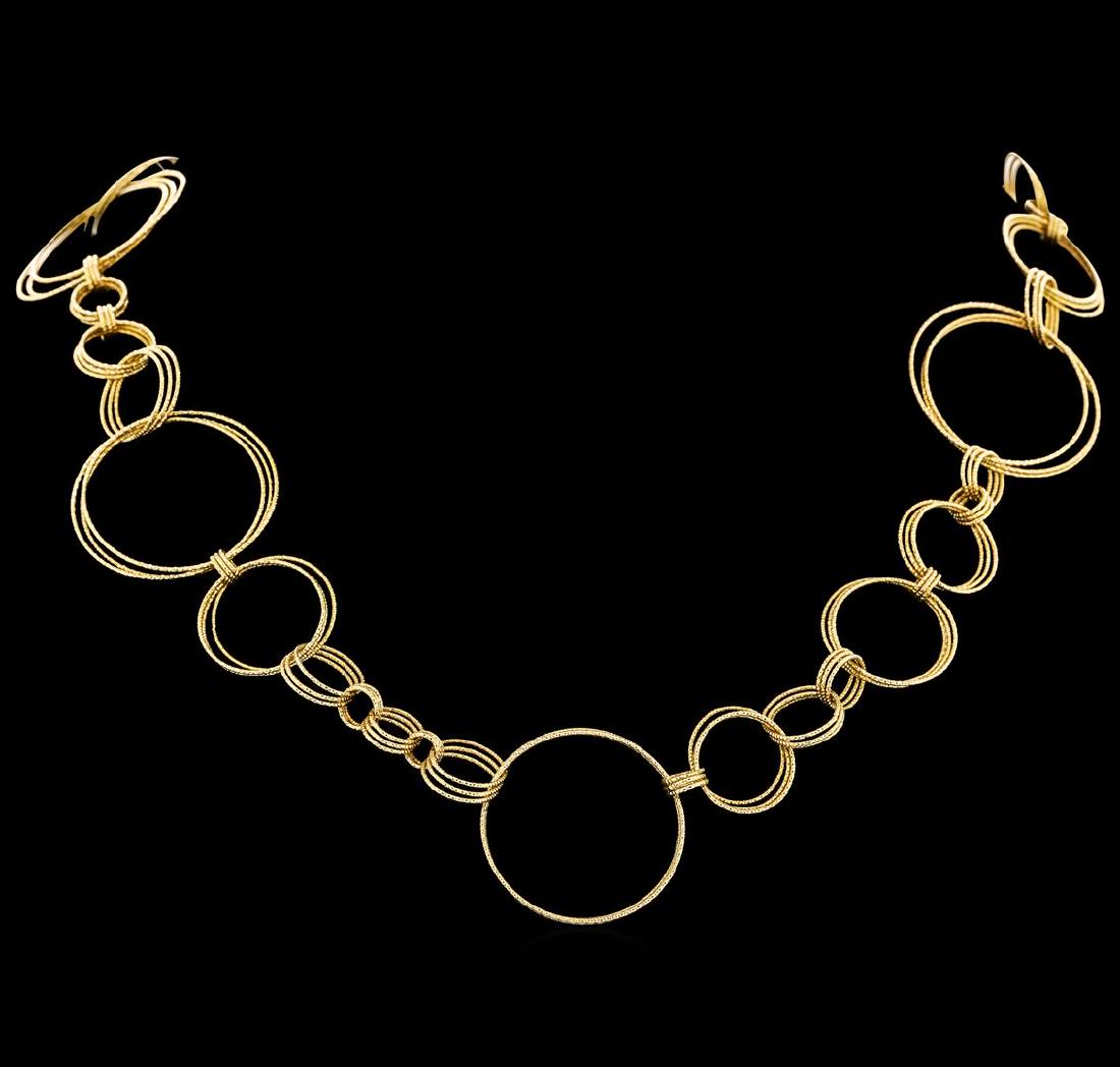 Roberto Coin Necklace - 18KT Yellow Gold: One electronically tested 18KT yellow gold lady's combination cast & assembled fashion circle necklace with a toggle clasp with a bright polish finish. The feature lady's necklace is a Roberto Coin ne