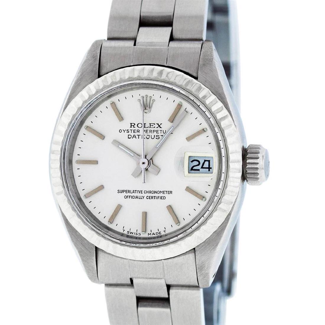 Rolex Ladies Stainless Steel Silver Index Oyster Band: One Ladies Stainless Steel Rolex Datejust Polished Bright with Satin Finish, Serviced & Electronically Tested, Stainless Steel Case: 26mm, Stainless Steel Crown, Bezel: 14K White Gold Fluted Bezel. Cu