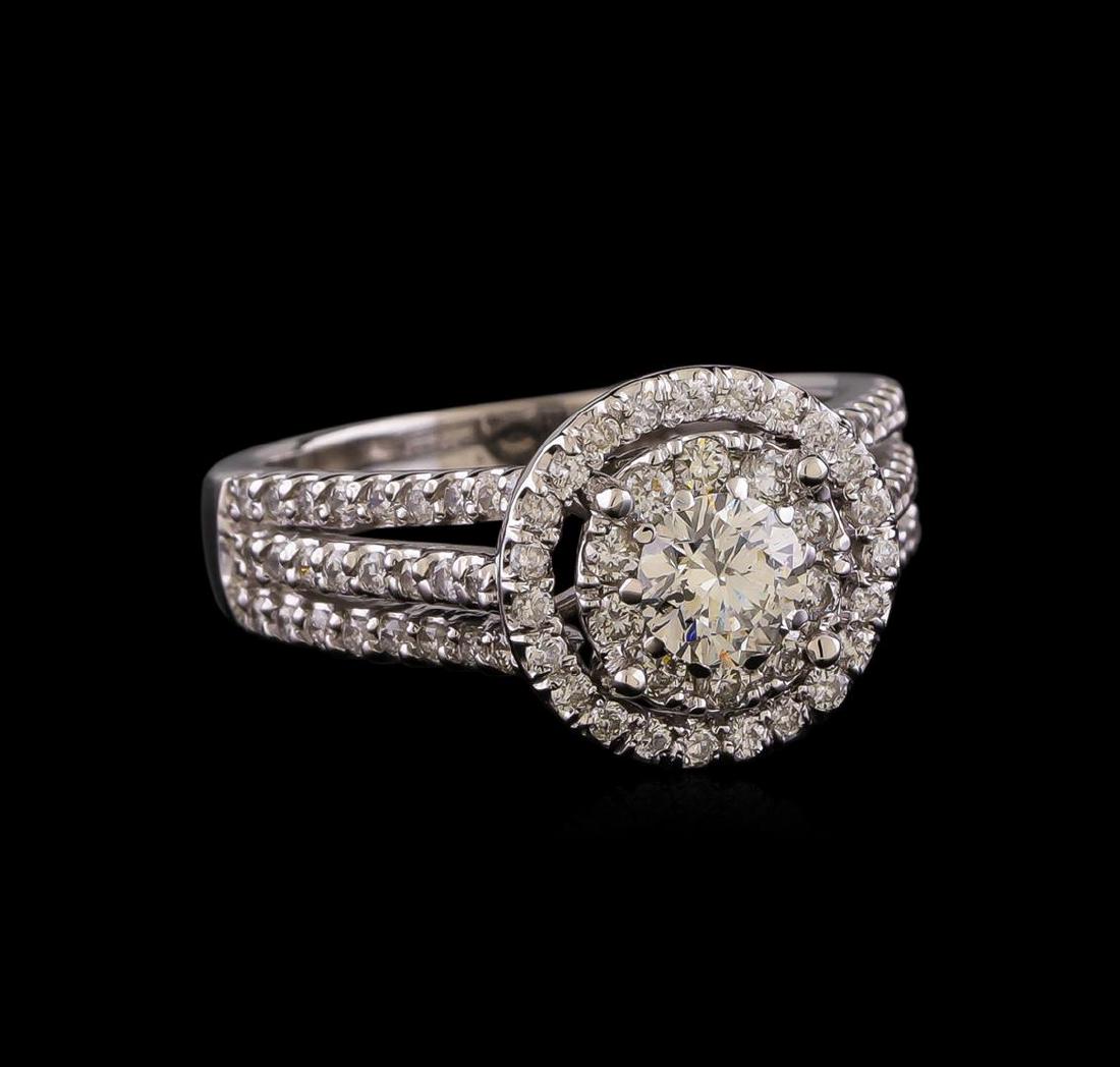 1.26 ctw Diamond Ring - 14KT White Gold: One electronically tested 14KT white gold lady's cast wedding ring with a split shank double halo with a bright polish finish. The featured lady's ring has a shank measuring 3.27 millimeters wide. Ide