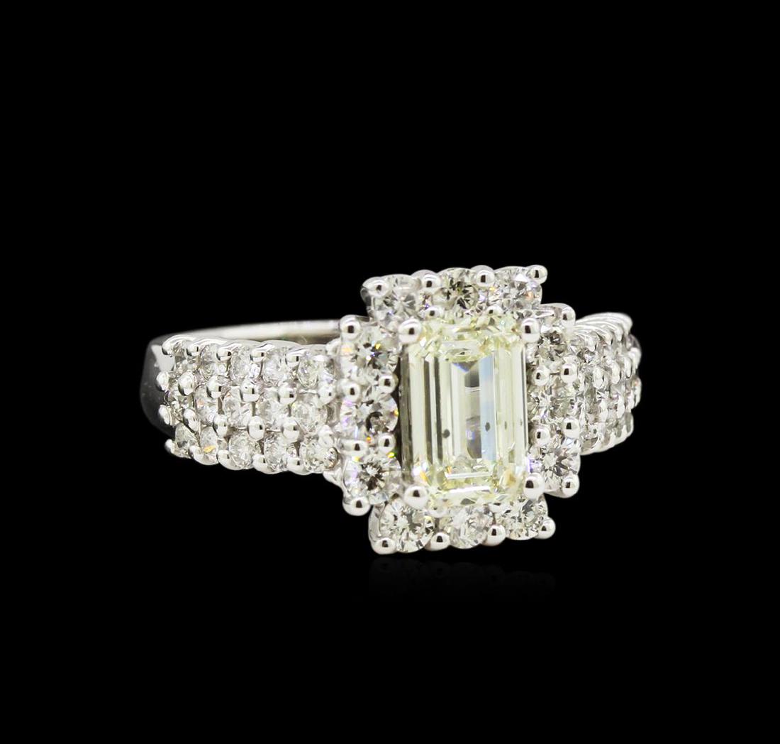 2.09 ctw Diamond Ring - 14KT White Gold: One electronically tested 14KT white gold lady's cast wedding ring with a basket halo with a bright polish finish. The featured lady's ring has a shank measuring 2.73 millimeters wide. Identified with
