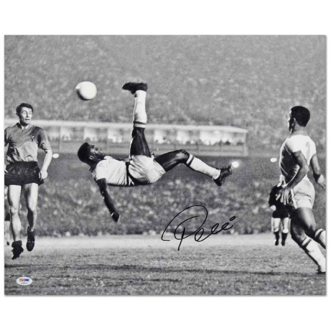 Scissor Kick (Pele - black/white) by Pele: "Scissor Kick" is a print on paper that is autographed by legendary Brazilian footballer, Pele! This piece is presented with a Certificate of Authenticity from PSA/DNA, which authenticates sports memo
