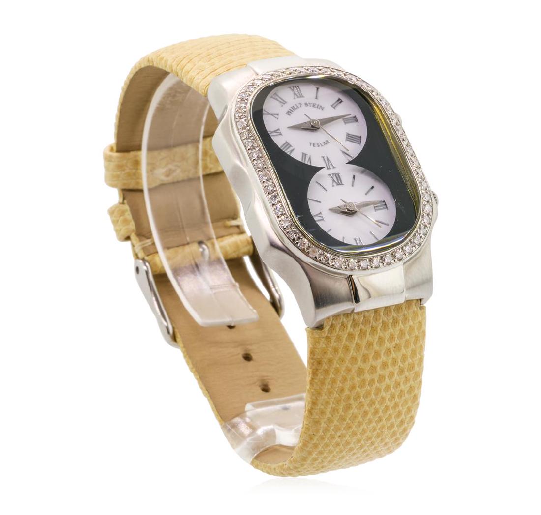 Philip Stein Lady's Teslar Wristwatch - Stainless Steel: One lady's Philip Stein Teslar stainless steel dual-time wristwatch with an attached tan leather strap. Serial #: 1009233. Crowns: fluted, pull-out. Bezel: diamond set, polished stainless steel. Cryst