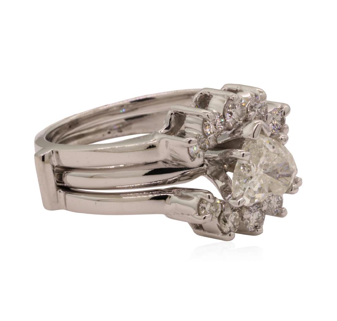 1.13 ctw Diamond Ring - Platinum: One electronically tested platinum lady's combination cast & assembled wedding solitaire soldered to ring guard with a basket semi-halo with a bright polish finish. The featured lady's ring has a trip