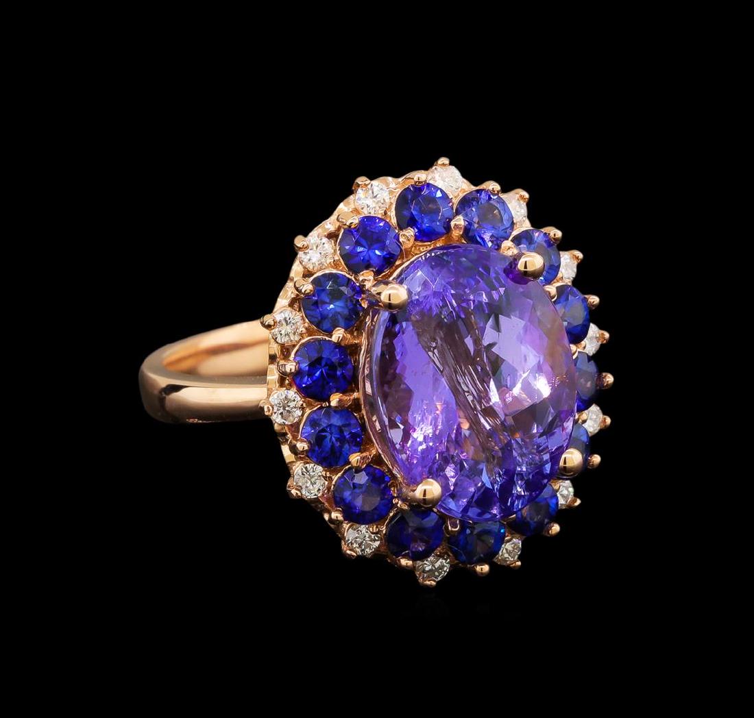 14KT Rose Gold 5.94 ctw Tanzanite, Sapphire and Diamond: One electronically tested 14KT rose gold ladies cast tanzinite, sapphire and diamond ring with a bright polish finish. Identified with markings of "14K". Condition is new. Containing: One prong set ov