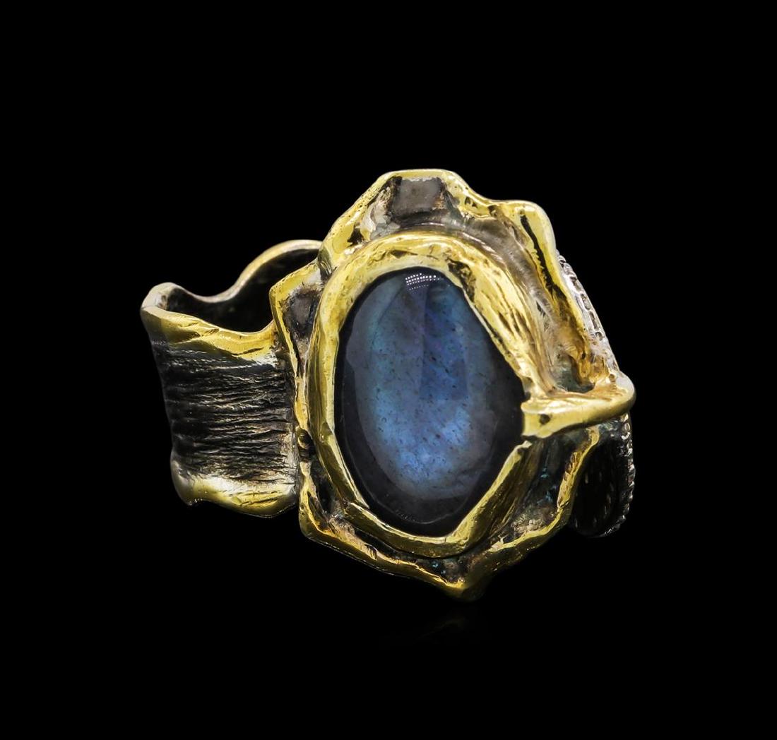 Sterling Silver Ring: One of a kind high fashion sterling silver Ring weighing 17.1 grams. Black Antique texture. Containing: Labradorite, White Crystal. This sterling silver promises a lasting shine.