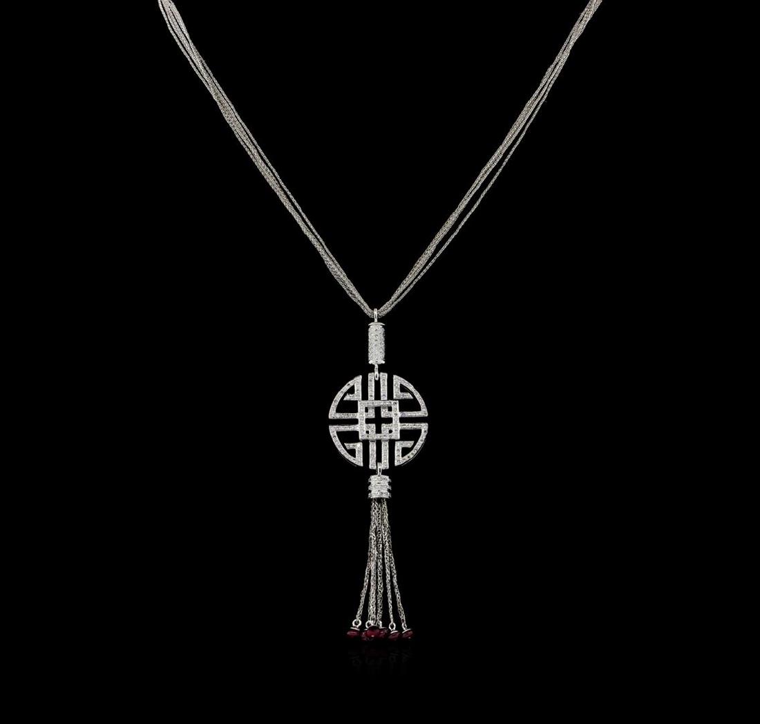 0.73 ctw Diamond and Ruby Pendant With Chain - 14KT: One electronically tested 14KT white gold ladies cast & assembled diamond and ruby pendant with chain. The pendant features an elaborate diamond set geometric design accented by a tassel consisting of