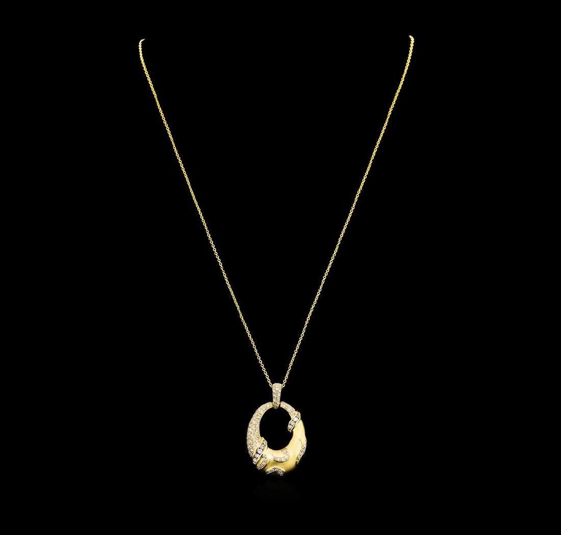 0.74 ctw Diamond Pendant & Chain - 14KT Yellow Gold: One electronically tested 14KT yellow gold lady's combination cast & assembled fashion pendant & chain 18.0' long, 1mm round cable link with a spring ring clasp with a bright polish finish. Trademark 