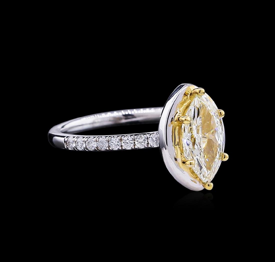 1.41 ctw Fancy Light Yellow Diamond Ring - 14KT: One electronically tested 14KT white and yellow gold lady's combination cast & assembled wedding ring with a bright polish finish. The featured lady's ring has a shank measuring 1.77 millimeters wide.