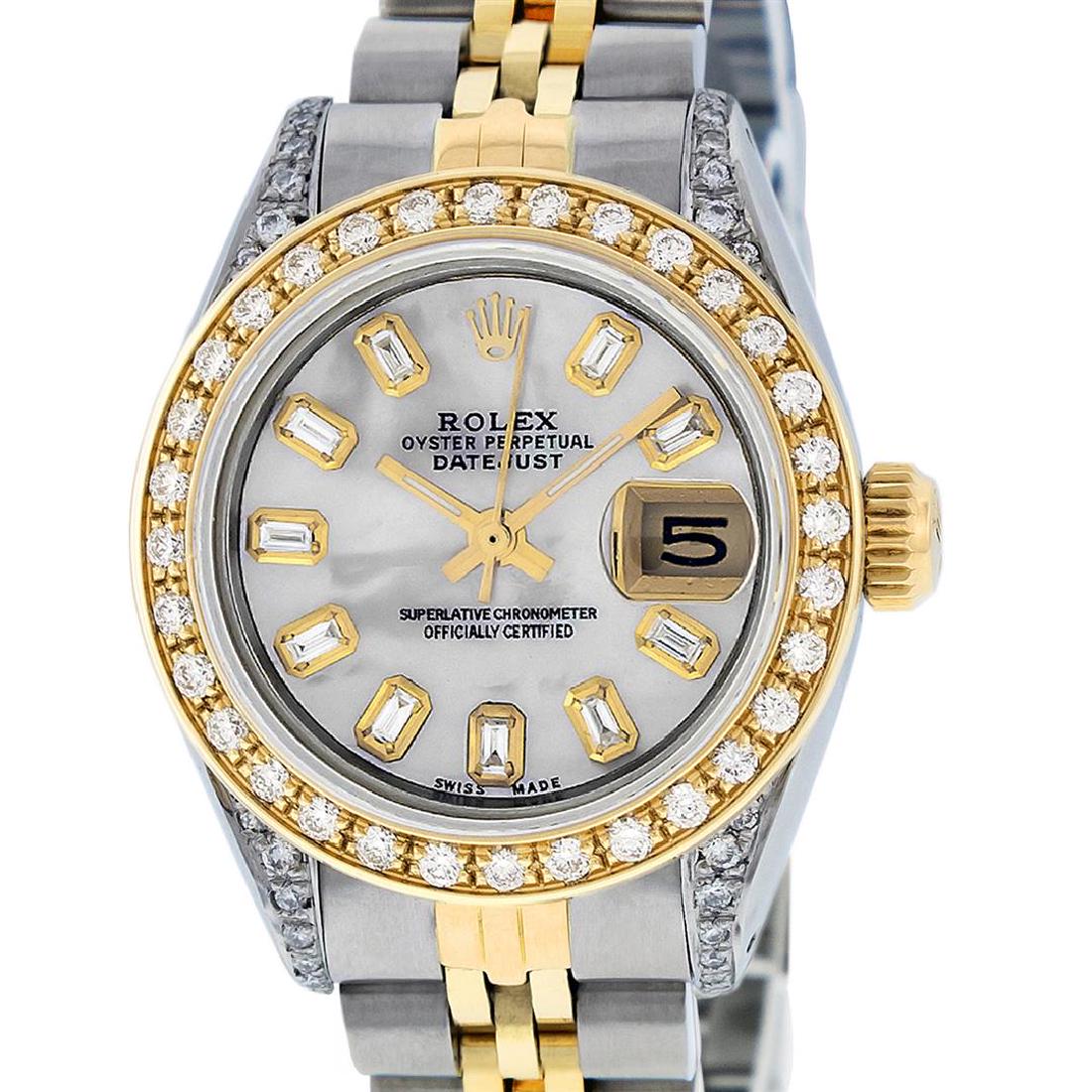 Rolex Ladies 2 Tone 14K MOP Baguette Diamond Lugs: One Ladies 14K Two Tone Rolex Datejust Polished, Serviced & Electronically Tested, 14K Yellow Gold & Stainless Steel Case: 26mm, 14K Yellow Gold Crown, Diamond Lugs: 24 Diamonds On Lugs, Clarity: SI-V